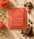 Brook37 Chocolate Hangover tea package with chocolate pieces and flowers on a marble surface