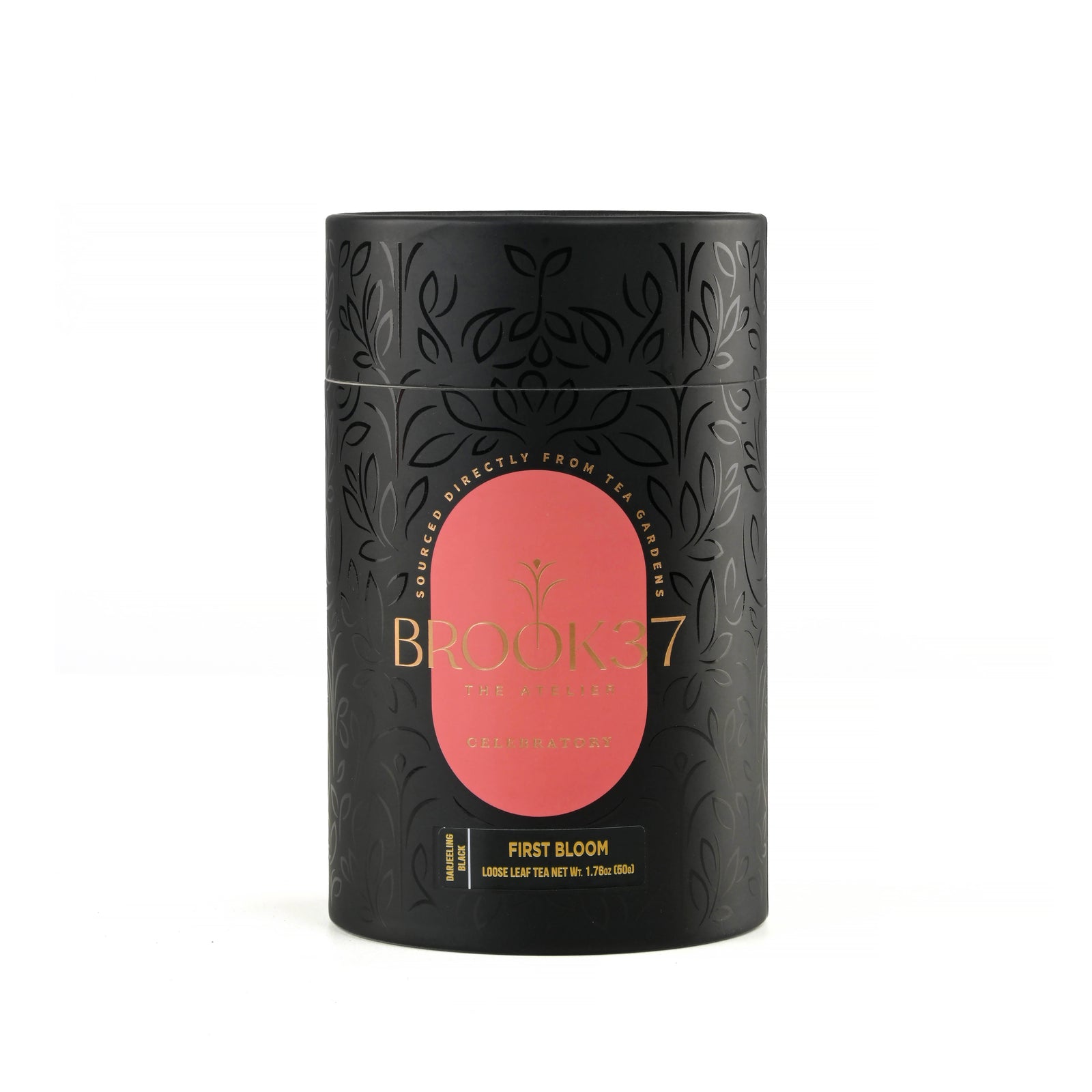 Brooke 7 first bloom tea in a black cylindrical tin with a pink oval label and gold lettering, set against a plain white background.