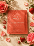 Brook37 pink rose strawberry product packaging surrounded by pink roses and strawberries on a marble surface.